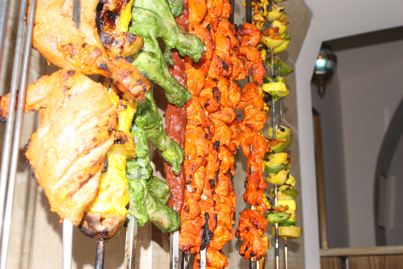 A rack of freshly grilled tandoori skewers